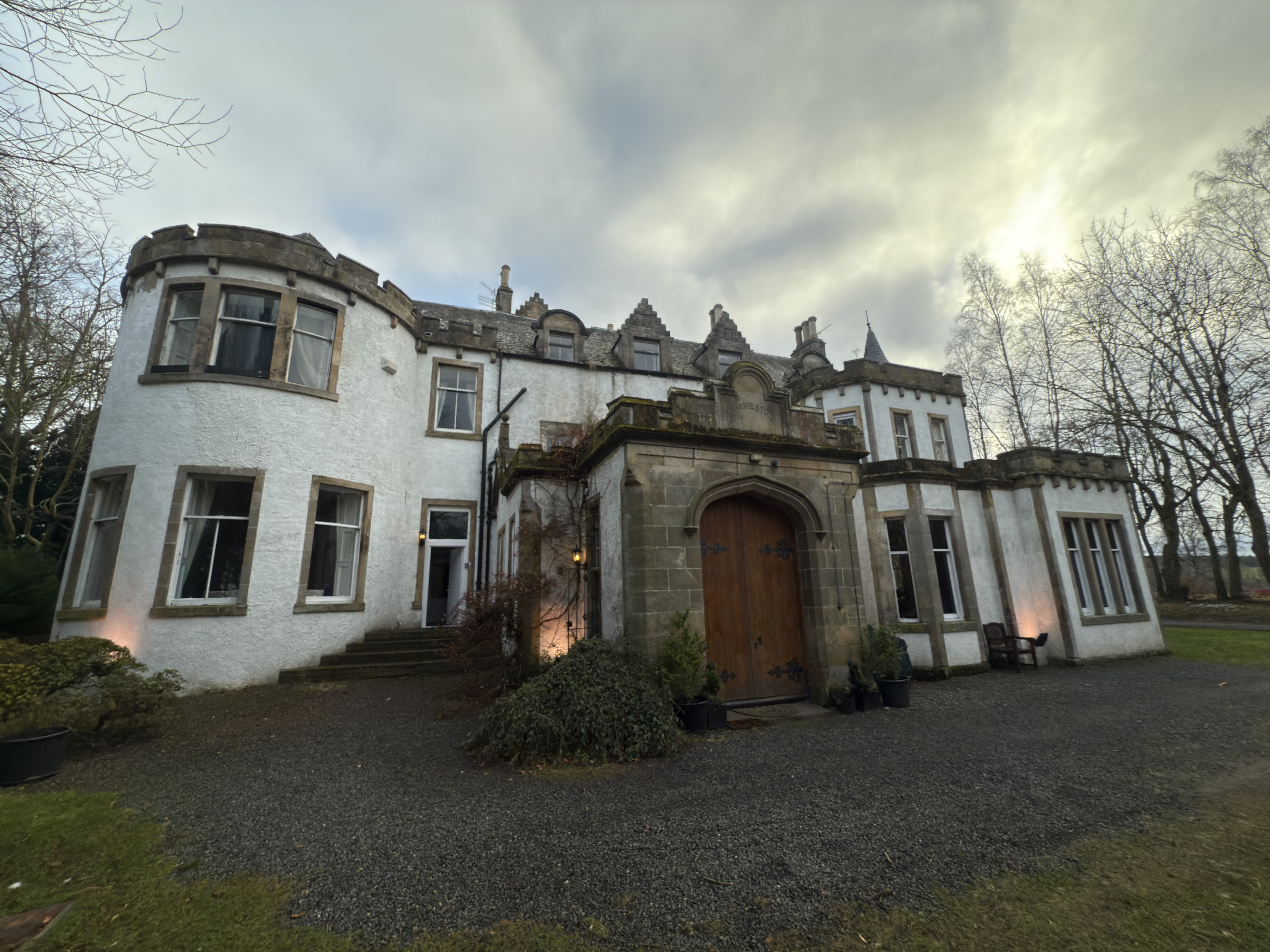 Front entrance and architectural detail of Harvieston Hall.